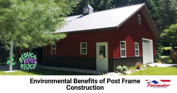 Red post frame home surrounded by large green trees.