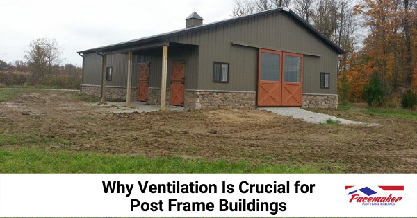 Post frame building surrounded by dirt and grass.